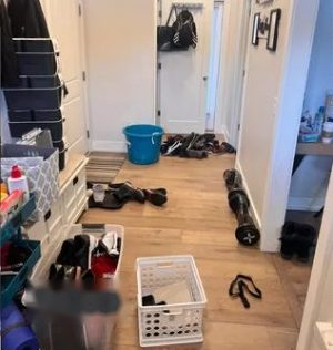 Hallway with shoes and items scattered before cleaning